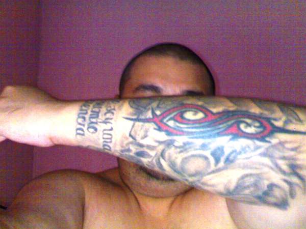 slip-biomech-skull-text tattoo