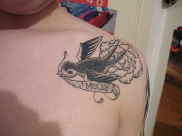 Swallow memorial tattoo