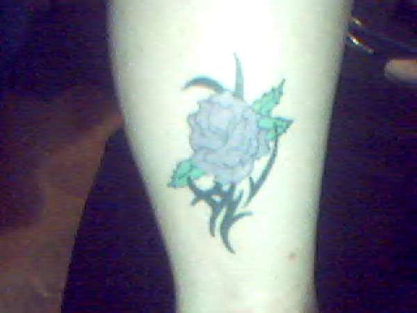 Rose with tribal tattoo