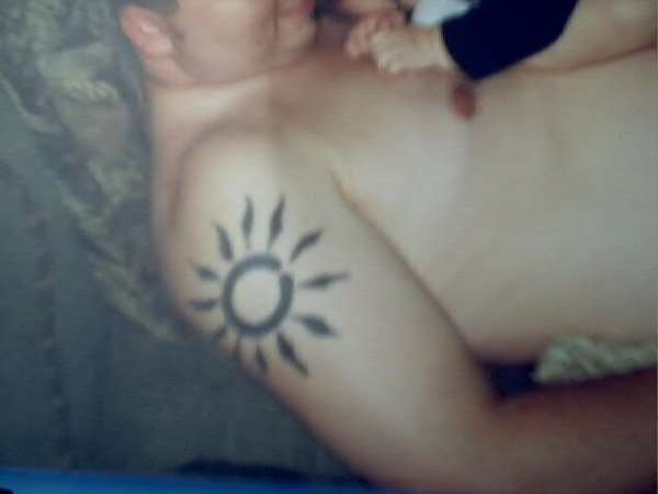 Tribal sun tattoo