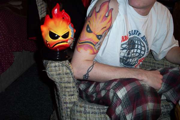 Flame face tattoo