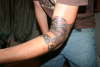 Lizard and arm band tattoo