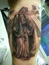 Religous piece tattoo