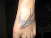 Swallow [left] tattoo