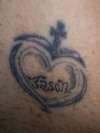 Tribal heart and cross with the name Jason. tattoo