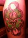 brass knuckles skull clover tattoo
