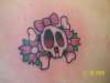 cute skull with flowers tattoo