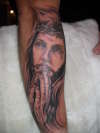 jesus on forearm tattoo
