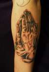 praying hands by mark cummings tattoo
