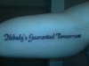 "Nobody's Guaranteed Tomorrow" tattoo