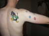 Stars and a Penguin tattoo