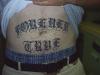 Stomach "Forever True" tattoo