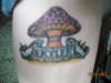 my sons name bannerd on a mushroom tattoo