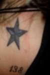 purple and black nautical star tattoo