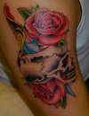 skull and dagger with roses tattoo