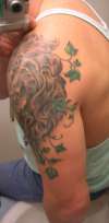 Stone Lion and Ivy rear tattoo