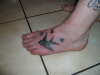 bird tattoo on feet