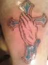 prayer hands with cross behind it tattoo