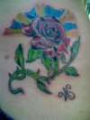 rose on hip tattoo