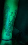 tourus skull wid couple rose under om tattoo