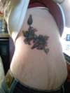 Colorful Flower Rib piece tattoo