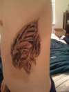 Eagle skin rip tattoo