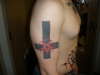 Inverted cross with pentegram tattoo