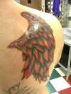 Red wing tattoo