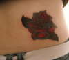Rose cover up tattoo