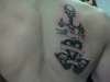 Skull, sword, and heart tattoo