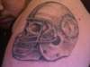 Skull wearing a Miami Dolphin Helmet tattoo