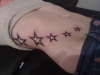 Stars on ribs tattoo