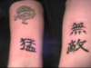 kanji..left means invincinble, right is fierce-above rose tattoo
