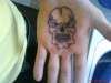 skull on palm of my hand tattoo
