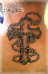 Cross and beads tattoo