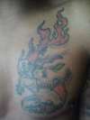 Flaming Capricorn tattoo