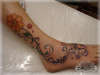 Flowers on foot tattoo