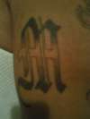 M in Old English tattoo