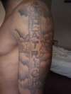 My name "PATRICK" in a cross tattoo