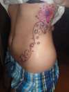 Flower on side tattoo