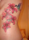 Lillies and a hummingbird tattoo