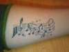 Musical arm tattoo