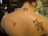 Top 3 tats on back tattoo