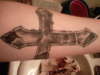 cracked cross tattoo