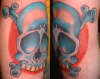 skull and cross bones on elbow tattoo