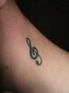 music note on neck tattoo