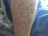 tribal leg tattoo