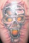 Skull on thigh tattoo