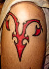 Tribal Uterus tattoo
