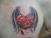 armored heart with wings tattoo